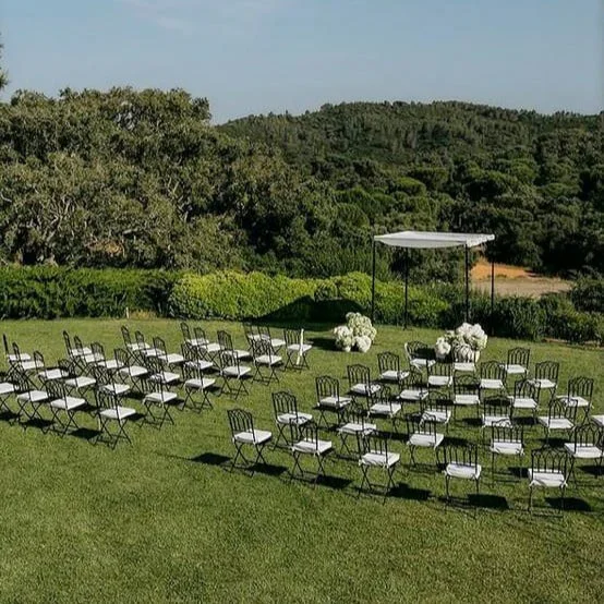 Modern and minimalist chuppah setup with white hydrangeas overlooking the hills of Setúbal at Hotel Casa Palmela