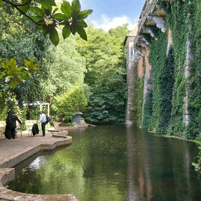 Explore the exclusive elegance of a Jewish wedding at Casa dos Penedos in Sintra. View our historic gardens featuring a serene pond and a beautifully set Chuppah hidden within the lush greenery, 