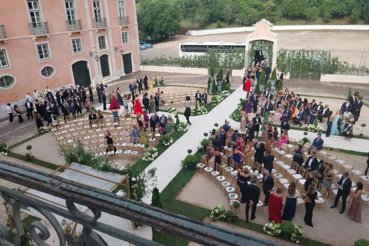 Guests gathered for a Jewish and interfaith wedding in the courtyard of Palácio do Correio-Mor, Portugal.