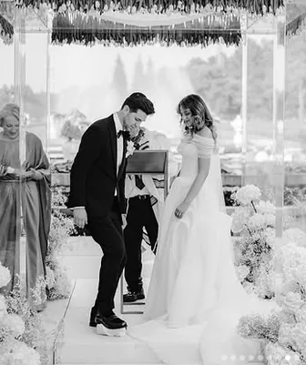 Black and white photograph of Jenn and Serge during their Jewish wedding ceremony in Portugal